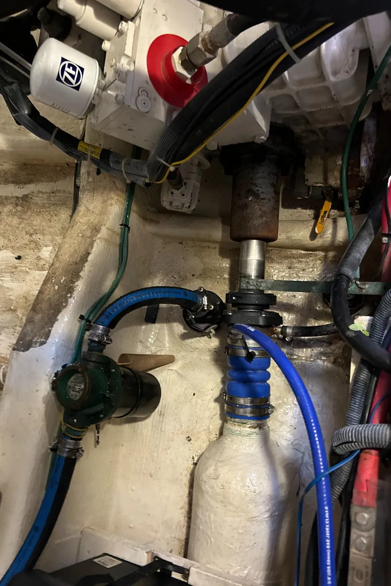 Slide: The Image of Engine compartment of 2005 Sabre 42 Hardtop Express with visible hoses and components. - 35