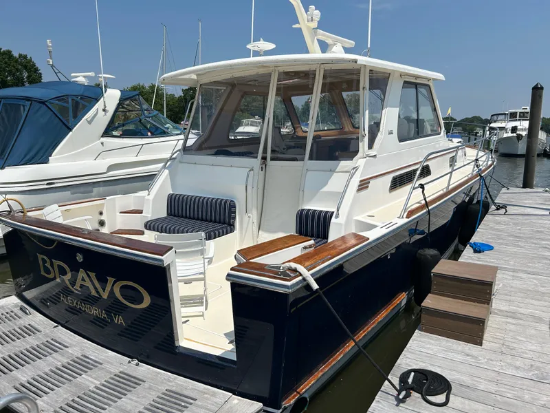 Slide: The Image of 2005 Sabre 42 Hardtop Express yacht docked, featuring elegant design and spacious seating. - 45