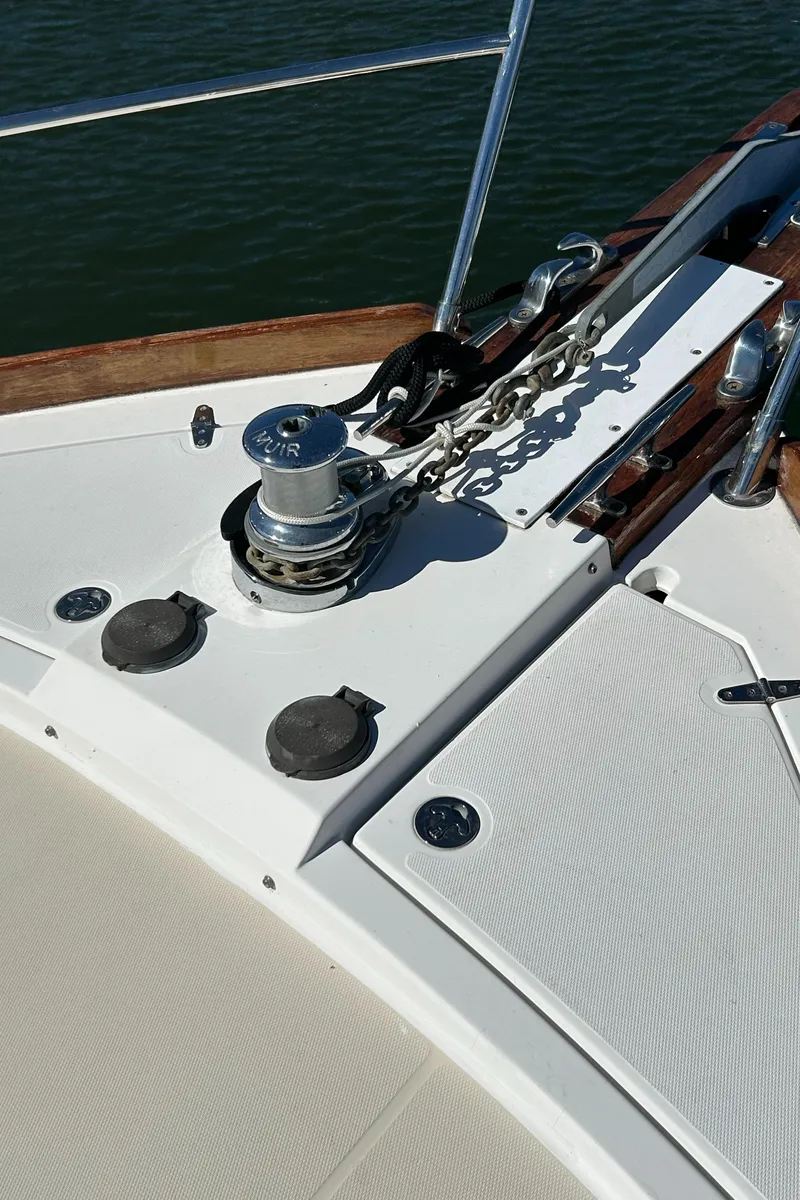 Slide: The Image of 2005 Sabre 42 Hardtop Express yacht deck with anchor winch and chain. - 9