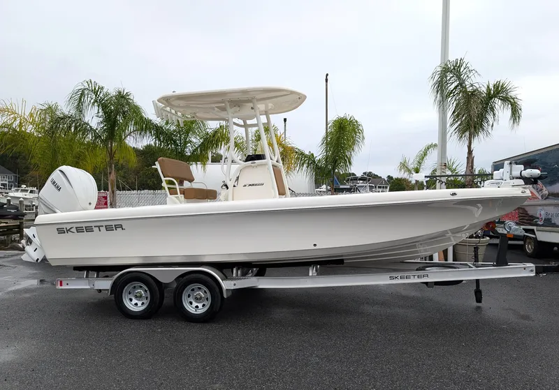 The Image of 2025 Skeeter SX 2350 boat on trailer, parked near palm trees. - 0