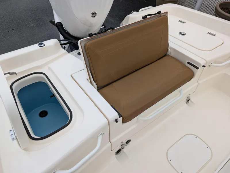 Slide: The Image of 2025 Skeeter SX 2350 boat interior with tan seating and storage compartments. - 11