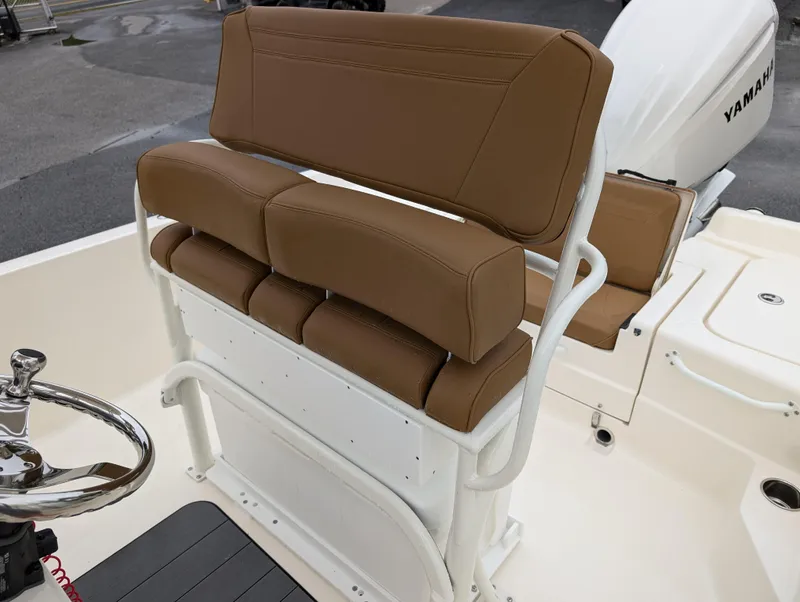 Slide: The Image of 2025 Skeeter SX 2350 boat with brown cushioned seating and Yamaha engine. - 15