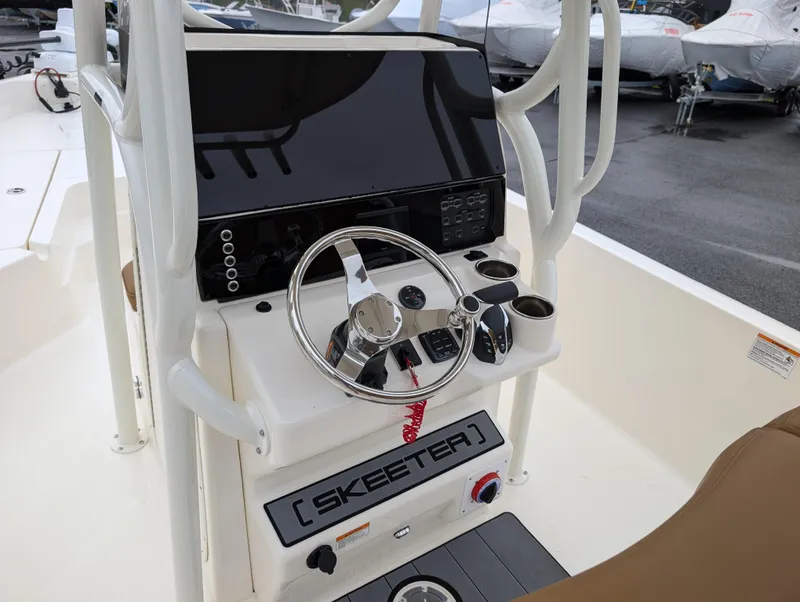 Slide: The Image of 2025 Skeeter SX 2350 boat console with steering wheel and controls. - 16