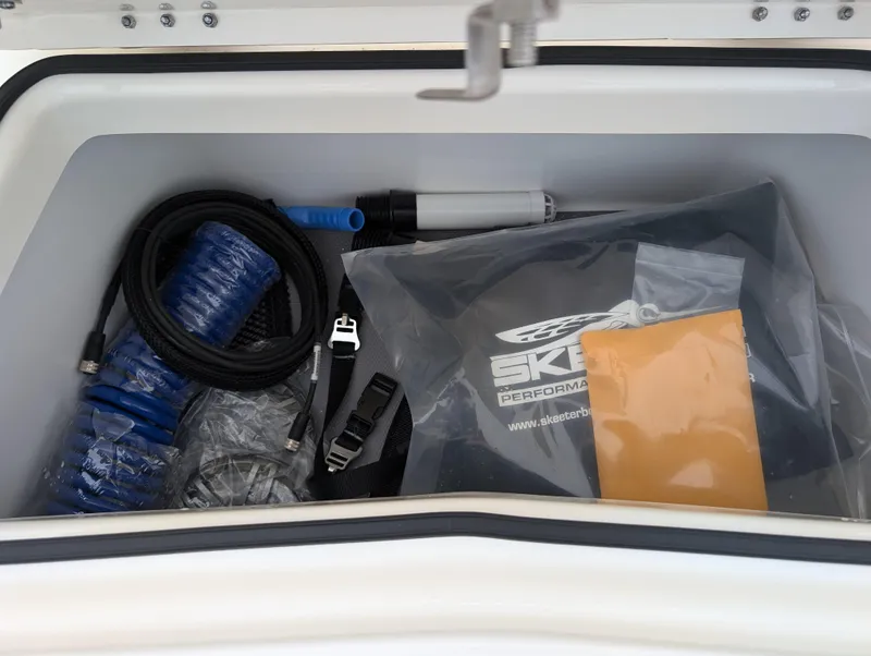 Slide: The Image of Storage compartment of 2025 Skeeter SX 2350 boat with accessories and equipment. - 23