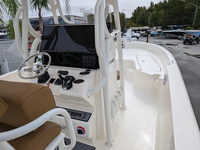 Slide: The Image of 2025 Skeeter SX 2350 boat interior with steering console and seating. - 30