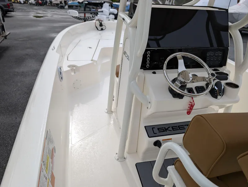 Slide: The Image of 2025 Skeeter SX 2350 boat interior with steering wheel and console. - 31