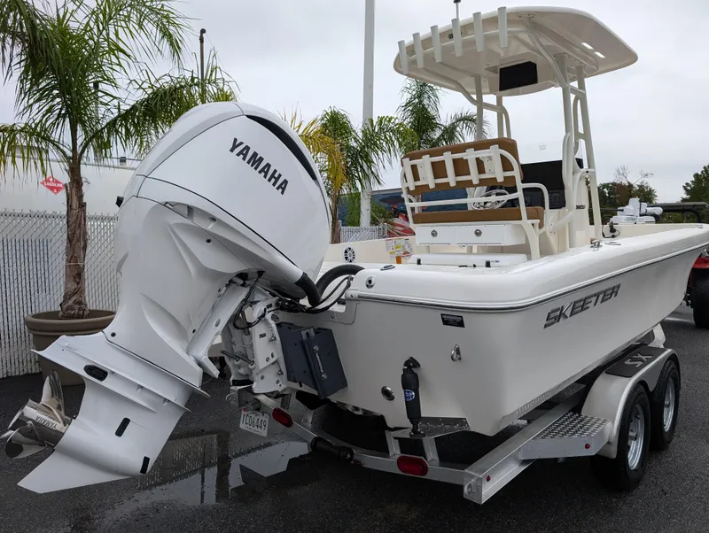 Slide: The Image of 2025 Skeeter SX 2350 boat with Yamaha outboard motor on trailer. - 7
