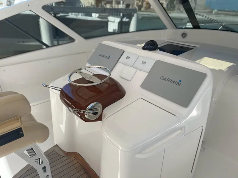 Slide: The Image of 2012 Viking 42 Open yacht helm with Garmin navigation system. - 12