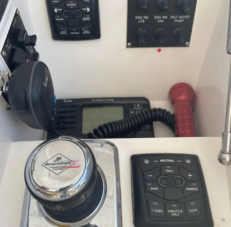 Slide: The Image of Control panel of a 2012 Viking 42 Open boat with various switches and devices. - 15