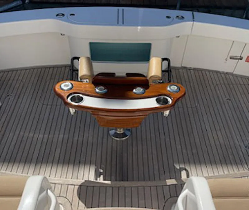 Slide: The Image of 2012 Viking 42 Open yacht deck with wooden fishing station and seating. - 18