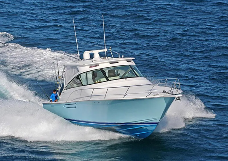 Slide: The Image of 2012 Viking 42 Open yacht cruising on open water. - 2