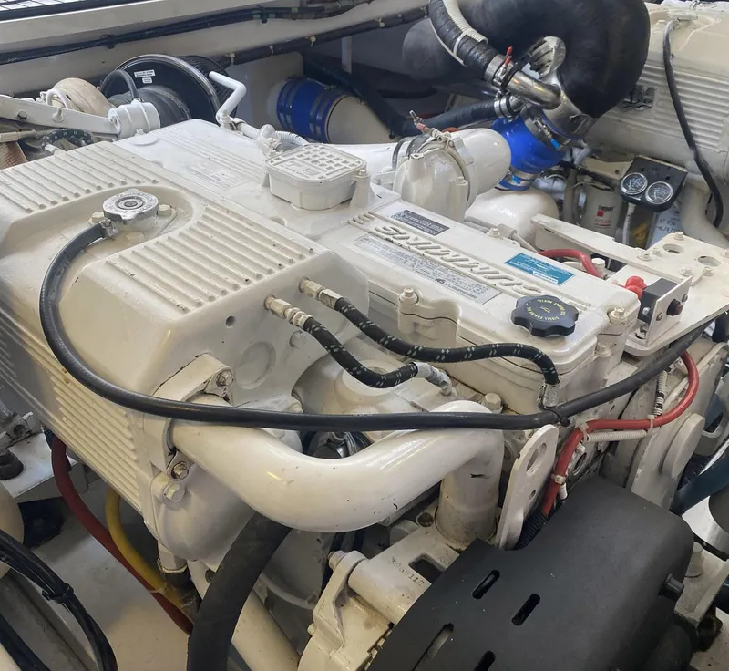 Slide: The Image of Engine compartment of a 2012 Viking 42 Open boat, showcasing detailed machinery. - 22