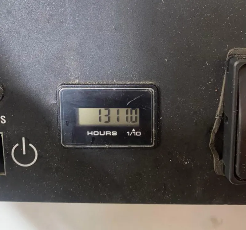 Slide: The Image of Hour meter displaying 1311 hours on a 2012 Viking 42 Open. - 24