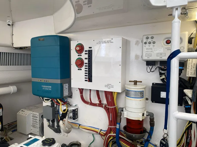 Slide: The Image of Electrical panel and components in a 2012 Viking 42 Open boat engine room. - 25