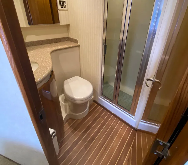 Slide: The Image of Bathroom interior of 2012 Viking 42 Open yacht with shower and wooden flooring. - 8