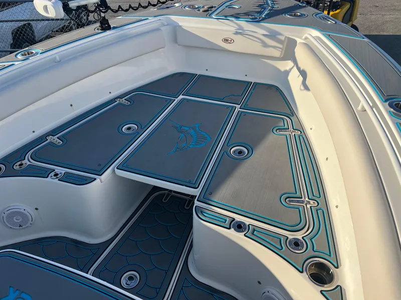Slide: The Image of 2020 Sea Hunt Gamefish 25 boat deck with custom blue and gray padding. - 12