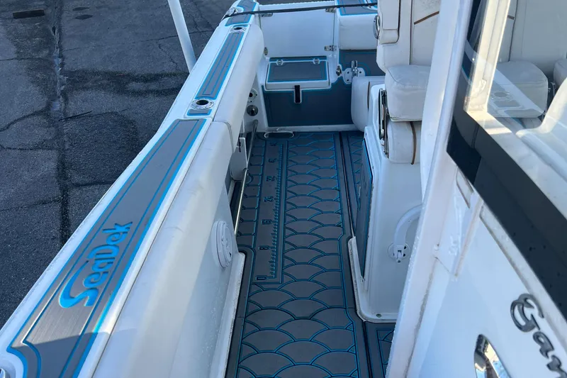 Slide: The Image of 2020 Sea Hunt Gamefish 25 boat interior with custom flooring and seating. - 21