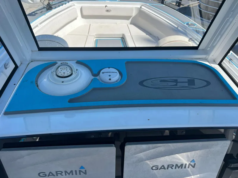 Slide: The Image of 2020 Sea Hunt Gamefish 25 boat dashboard with Garmin electronics and compass. - 6
