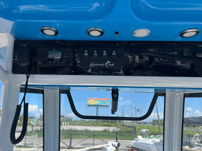 Slide: The Image of 2020 Sea Hunt Gamefish 25 dashboard with controls and radio equipment. - 7