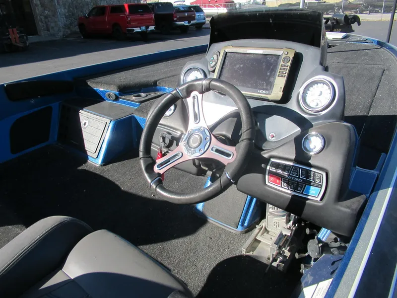 Slide: The Image of 2016 Nitro Z21 boat cockpit with steering wheel and dashboard controls. - 3