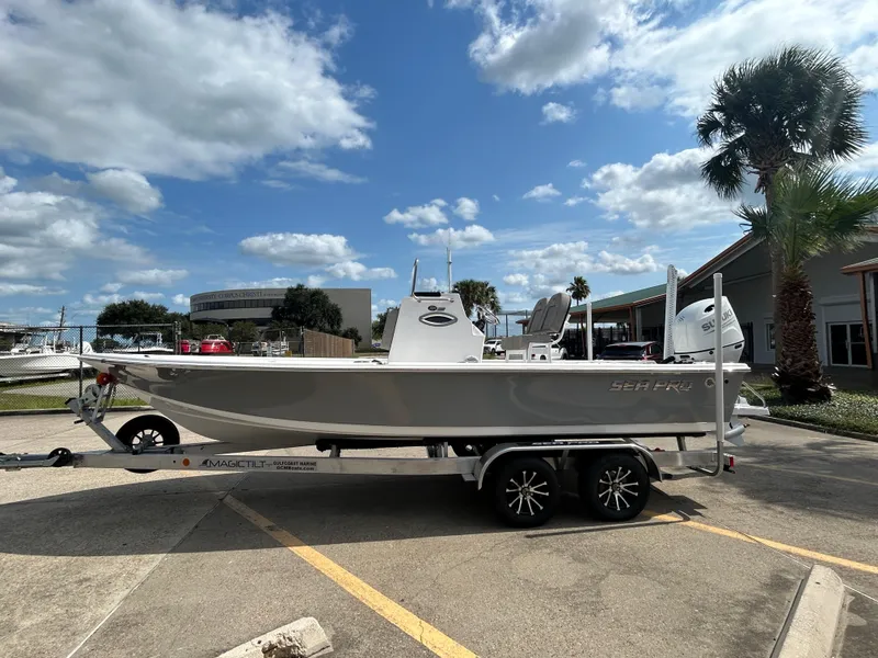 The Image of 2025 Sea Pro 230 Bay boat on trailer, parked outside Gulf Coast Marine. - 0