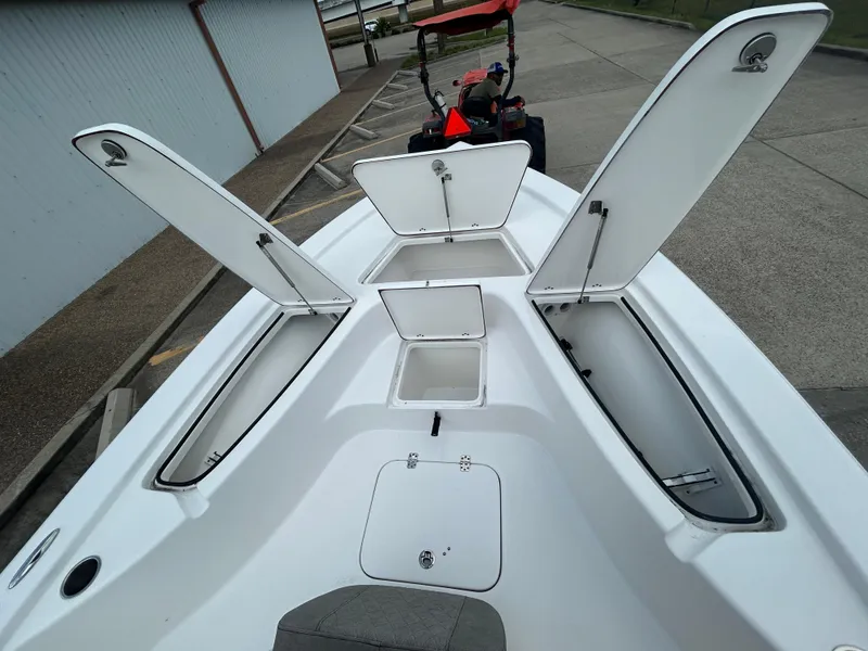 Slide: The Image of 2025 Sea Pro 230 Bay boat console with steering wheel and Simrad electronics. - 14