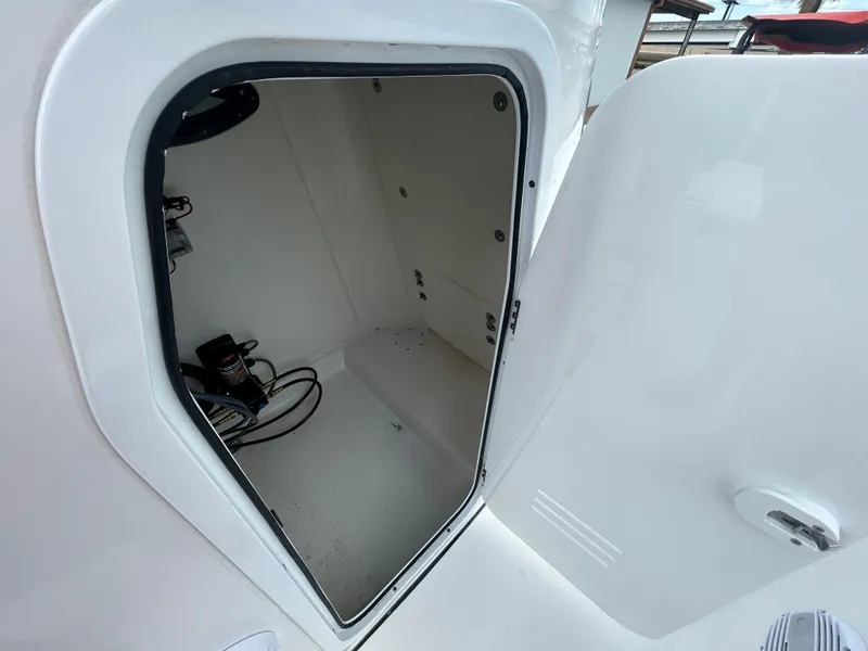 Slide: The Image of 2025 Sea Pro 230 Bay boat with open storage compartments. - 17