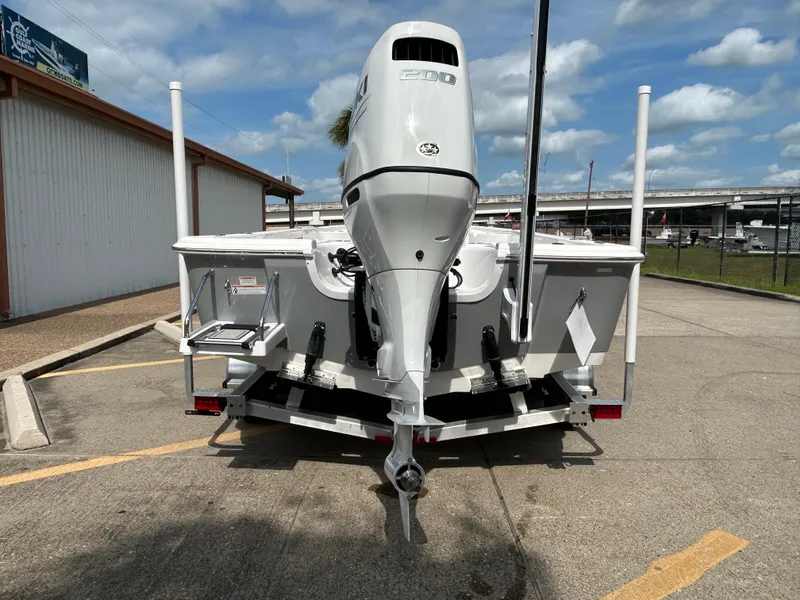 Slide: The Image of 2025 Sea Pro 230 Bay boat on trailer, featuring Suzuki outboard motor. - 6