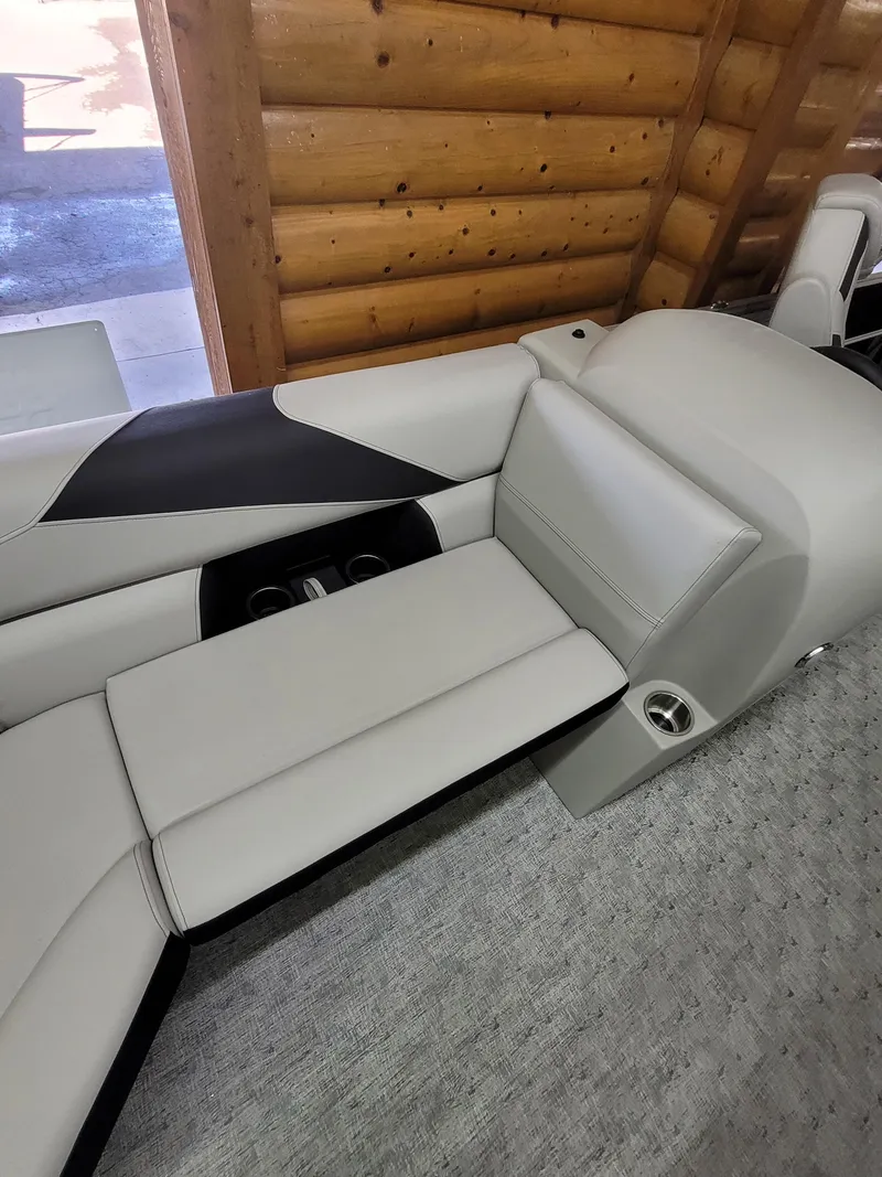 Slide: The Image of 2025 Trifecta 22TRC2LE275 boat interior with sleek, modern seating and cup holders. - 13