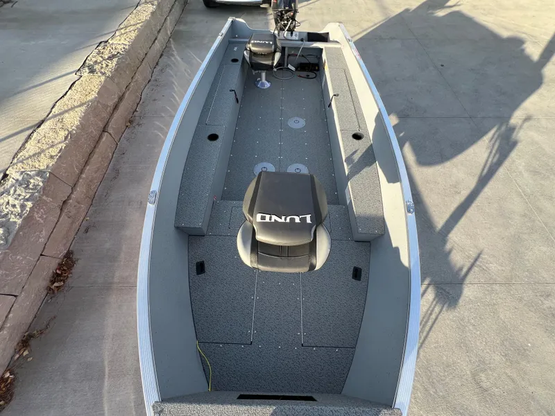 Slide: The Image of 2025 Lund 1600 Fury Tiller boat, gray interior, single seat, spacious deck. - 7