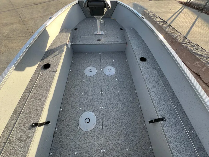 Slide: The Image of 2025 Lund 1600 Fury Tiller boat interior with spacious seating and storage. - 9