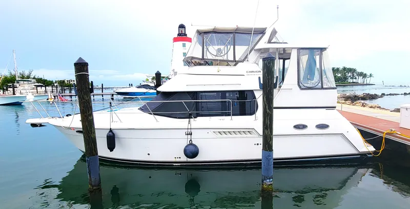 Slide: The Image of 1999 Carver 356 Aft Cabin Motor Yacht docked at marina. - 1