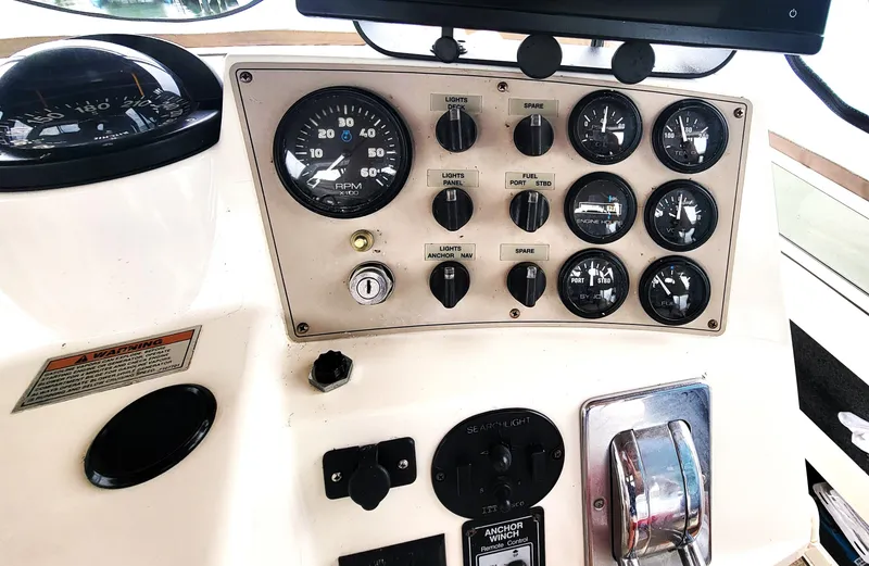 Slide: The Image of Control panel of 1999 Carver 356 Aft Cabin Motor Yacht with gauges and switches. - 17