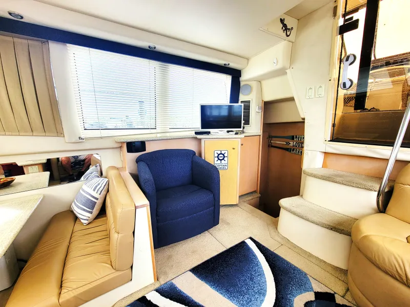 Slide: The Image of Interior of 1999 Carver 356 Aft Cabin Motor Yacht with seating and TV. - 2