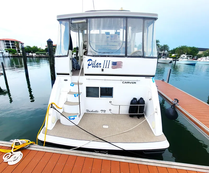 Slide: The Image of 1999 Carver 356 Aft Cabin Motor Yacht docked at marina. - 21