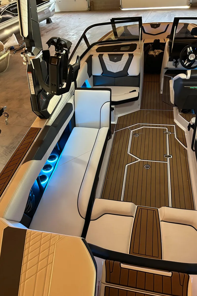 Slide: The Image of 2022 Nautique Super Air Nautique G25 interior with sleek seating and modern design. - 19