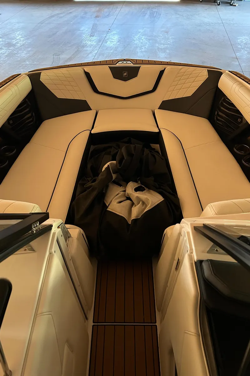 Slide: The Image of 2022 Nautique Super Air Nautique G25 interior with beige seating and sleek design. - 26