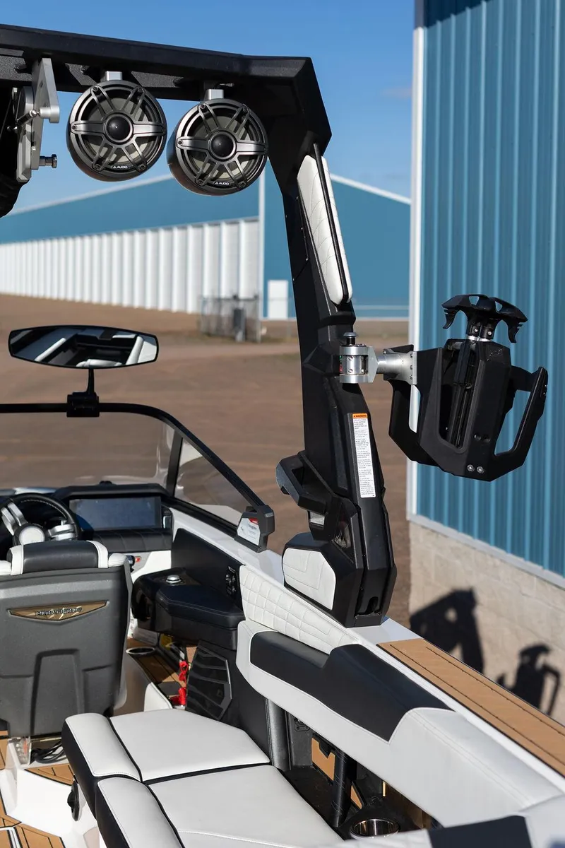 Slide: The Image of 2022 Nautique Super Air Nautique G25 interior with speakers and seating. - 8