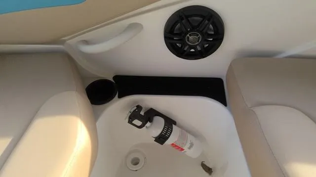 Slide: The Image of 2025 Hurricane SunDeck Sport 205 OB interior with fire extinguisher and speaker. - 17