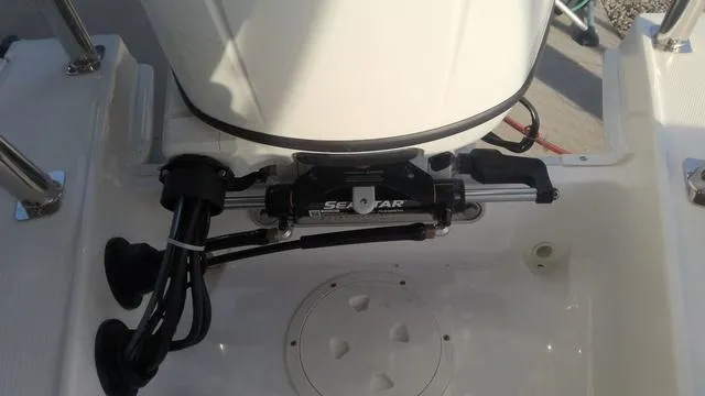 Slide: The Image of 2025 Hurricane SunDeck Sport 205 OB boat engine compartment with SeaStar hydraulic steering. - 26