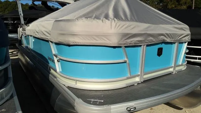 Slide: The Image of 2025 Godfrey Pontoons Sweetwater 2086 CSE with cover, blue exterior, docked. - 2