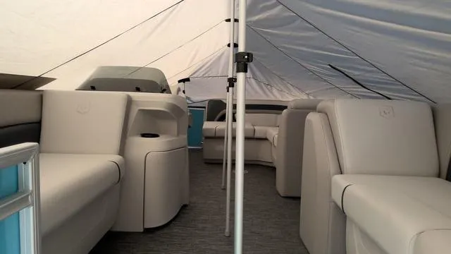 Slide: The Image of Interior of 2025 Godfrey Pontoons Sweetwater 2086 CSE, featuring spacious seating under a canopy. - 4