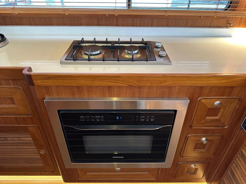 Slide: The Image of Modern kitchen in 2023 Helmsman Trawlers 43E PILOTHOUSE with stove and oven. - 14