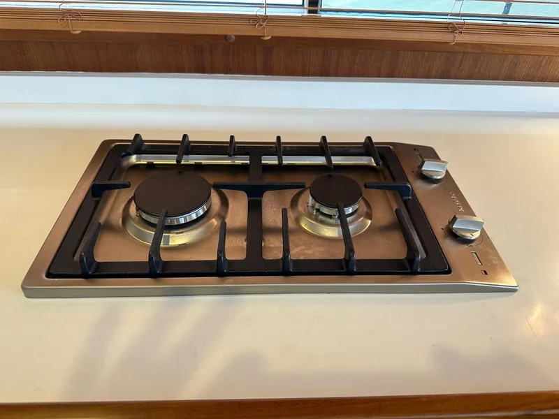 Slide: The Image of Stainless steel gas stove in 2023 Helmsman Trawlers 43E PILOTHOUSE kitchen. - 15