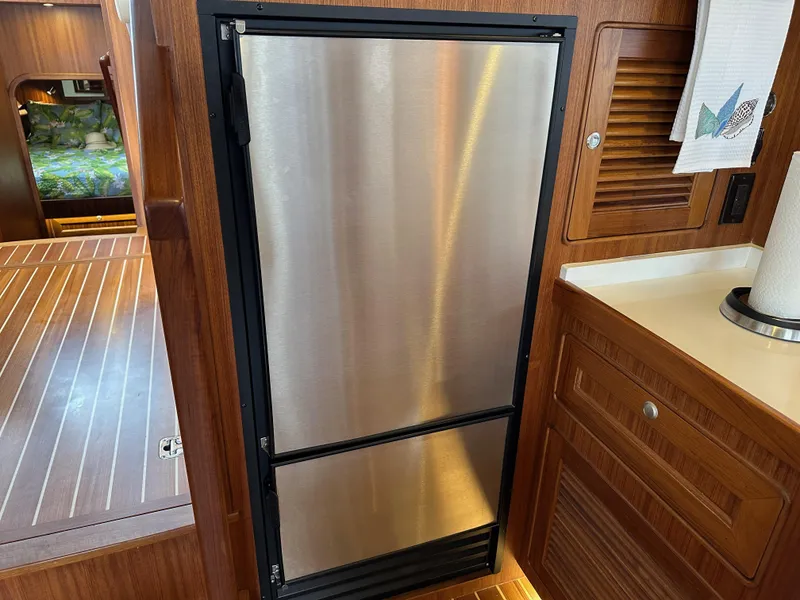Slide: The Image of Stainless steel refrigerator in 2023 Helmsman Trawlers 43E Pilothouse interior. - 17