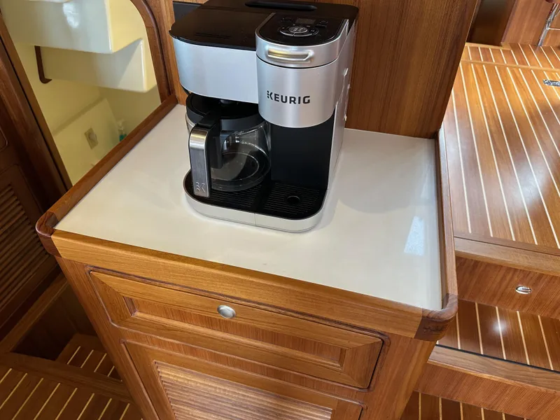 Slide: The Image of Keurig coffee maker on Helmsman Trawlers 43E PILOTHOUSE, 2023 model, wooden interior. - 20