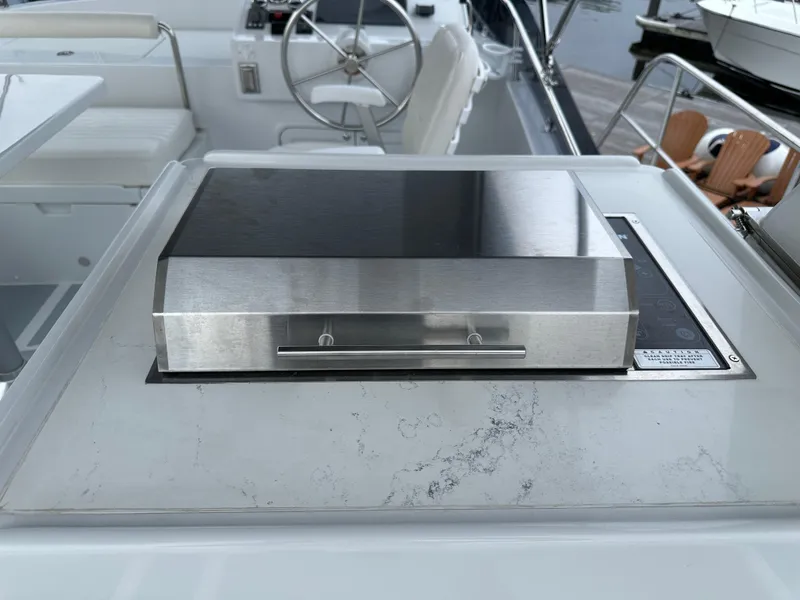 Slide: The Image of Stainless steel grill on 2023 Helmsman Trawlers 43E PILOTHOUSE yacht deck. - 46