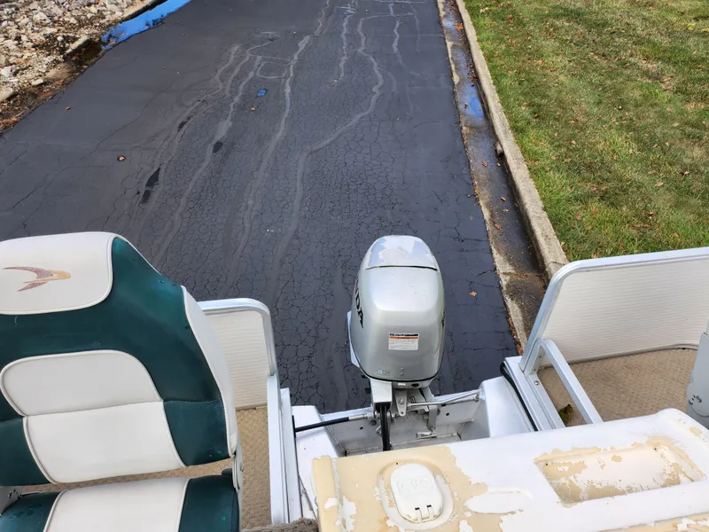 Slide: The Image of 2002 Harris FloteBote 220 Fisherman boat with motor, parked on asphalt near grass. - 16