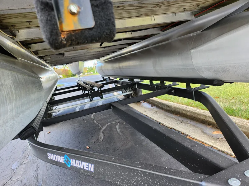 Slide: The Image of Underneath view of a 2002 Harris FloteBote 220 Fisherman on a Shore Haven trailer. - 7