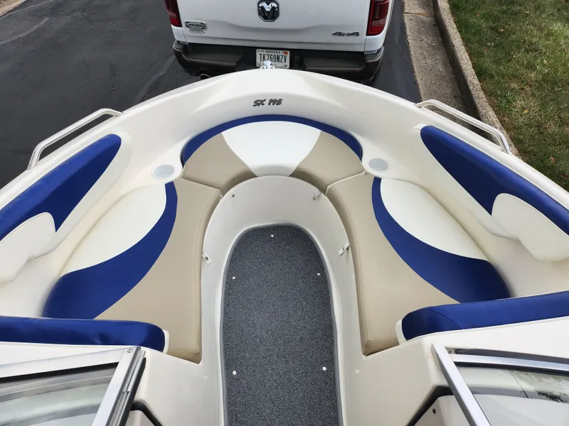 Slide: The Image of 2006 Glastron SX 195 boat interior with blue and beige seating. - 18